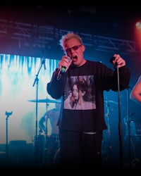 a man is singing into a microphone